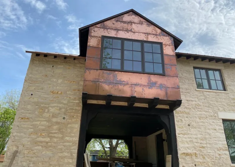 Copper metal panel facade on a stone building for Skylight Installation in Beavercreek