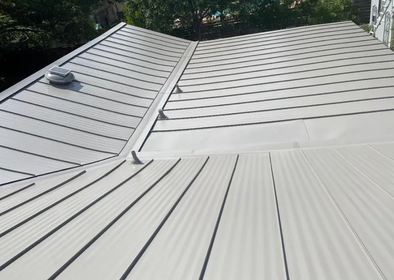 Solar attic fan installed on a metal roof for Roof Ventilation in Beavercreek